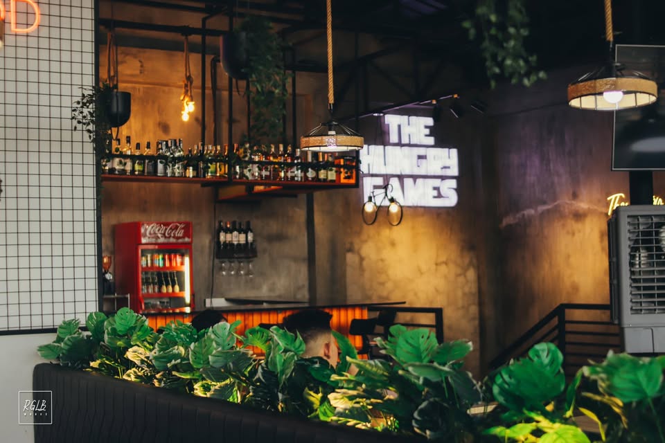 The Hungry Games bar interior with neon sign
